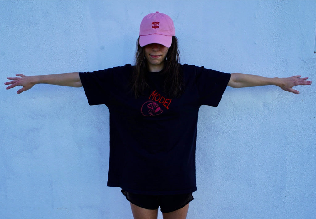 MODEL - a livin’ model, a classy color of choice shirt with love stricken skull head luvin mode